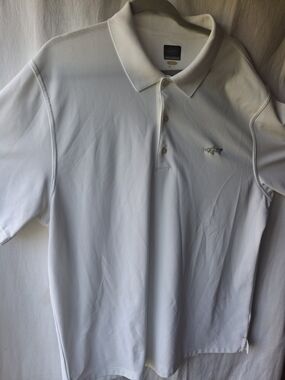 Greg Norman Collection White Polo with Shark Emblem